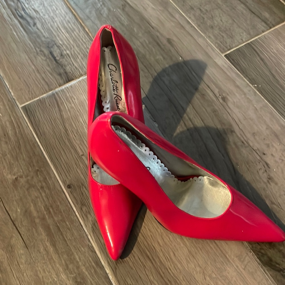 Size 7 pink heels. Never been worn.